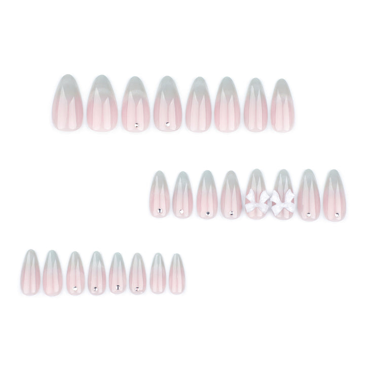 Elegant Stiletto Nails with Glitter and Bow Accents Bowlift