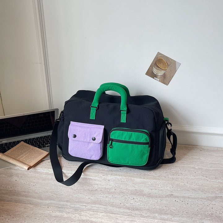 Sporty travel bag with multifunctional outer pockets Bowlift
