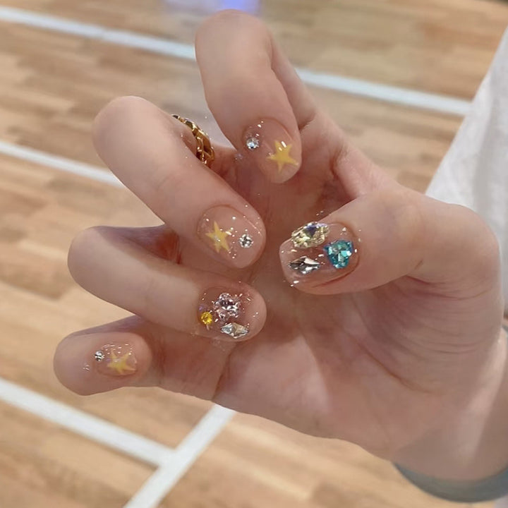 Artistic Press-On Nail Set with Gemstone and Star Accents Bowlift