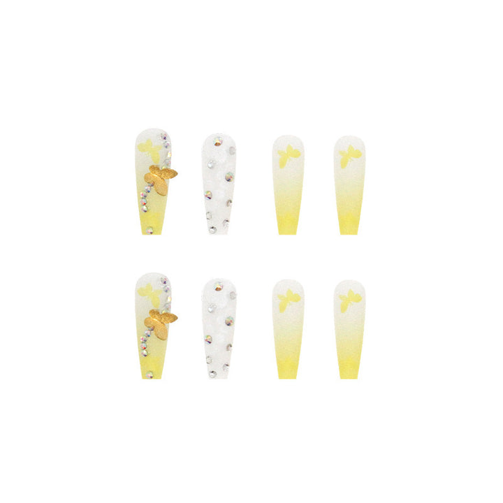 Artificial nail extensions with floral accents and rhinestones Bowlift