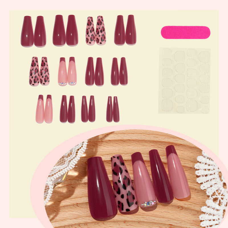 Artificial nail set with elegant animal print and glitter accents Bowlift