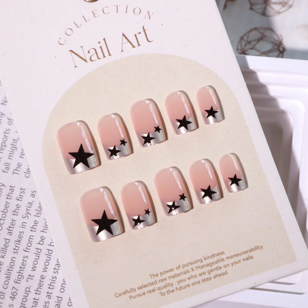 Sparkling nail art with stars and glitter accents Bowlift
