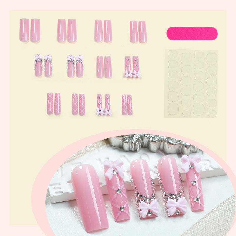 Artificial nail set with romantic bow and glitter accents Bowlift