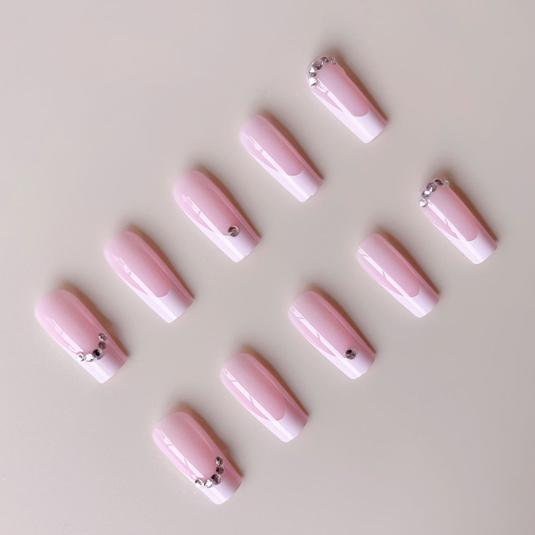 Acrylic nail set with elegant high-gloss finish and luxury rhinestone embellishments Bowlift