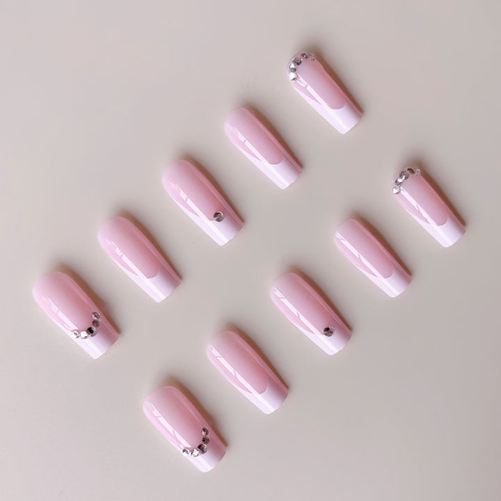 Acrylic nail set with elegant high-gloss finish and luxury rhinestone embellishments Bowlift
