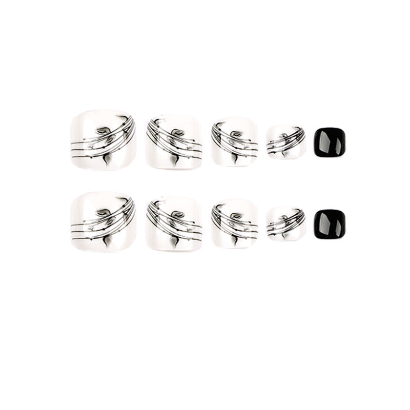 Artful toenail art in elegant black and white design Bowlift