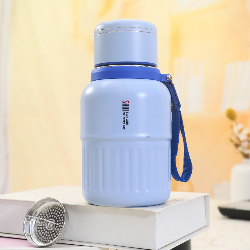 Insulated drinking bottle with integrated carrying strap Bowlift