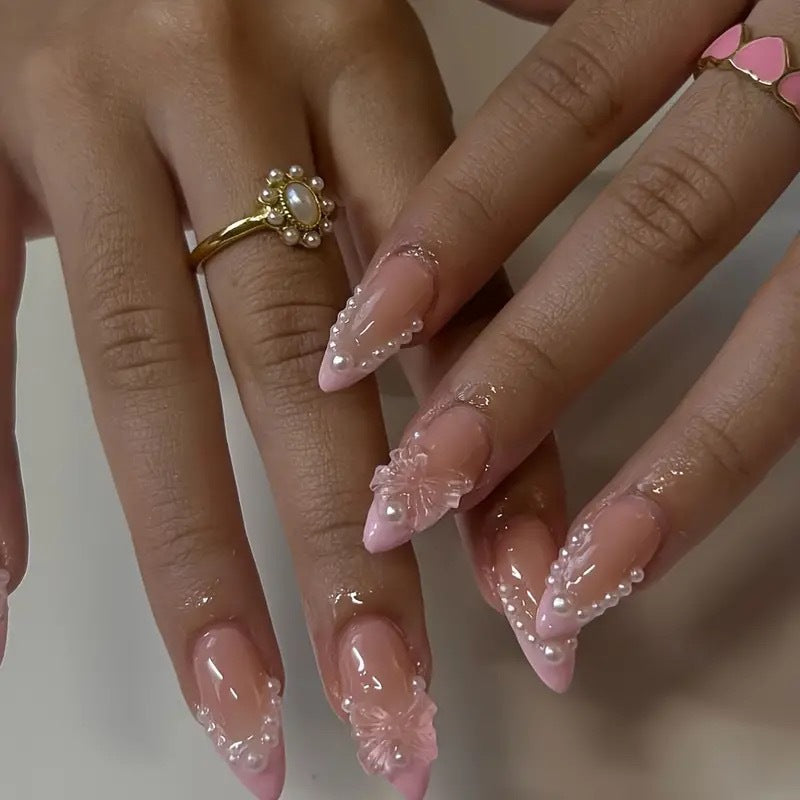 Art nail tips with delicate pearl and butterfly accents Bowlift