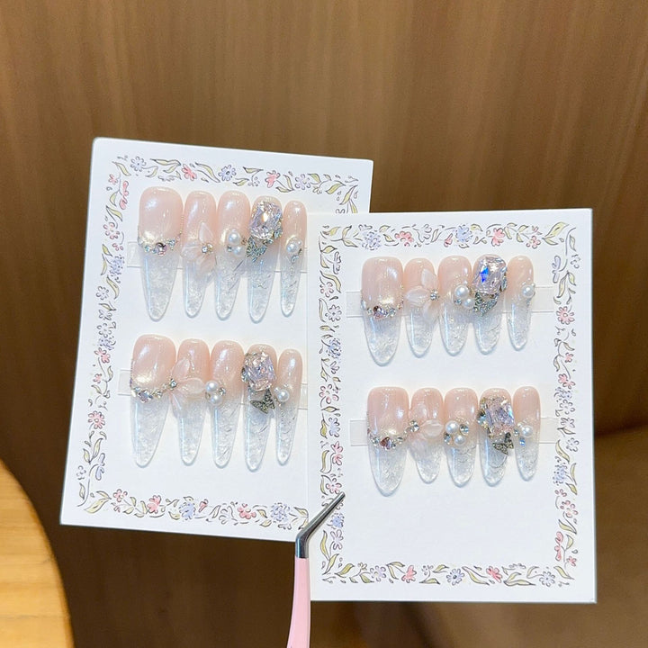 Artificial nails with delicate glitter and pearl decoration Bowlift