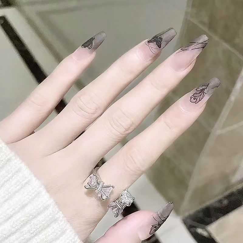Artificial nail set with elegant flower design and delicate butterfly motifs Bowlift