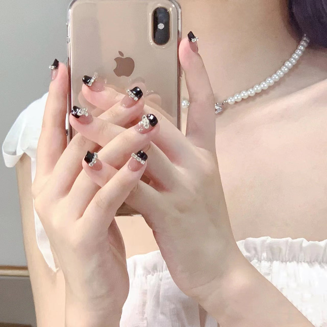 Glamorous nail art with rhinestone embellishments Bowlift