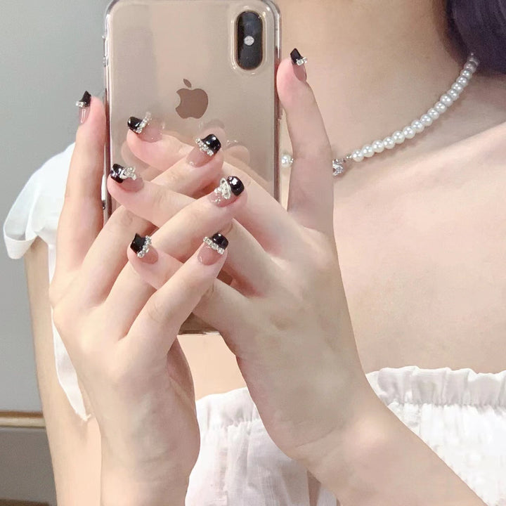 Glamorous nail art with rhinestone embellishments Bowlift