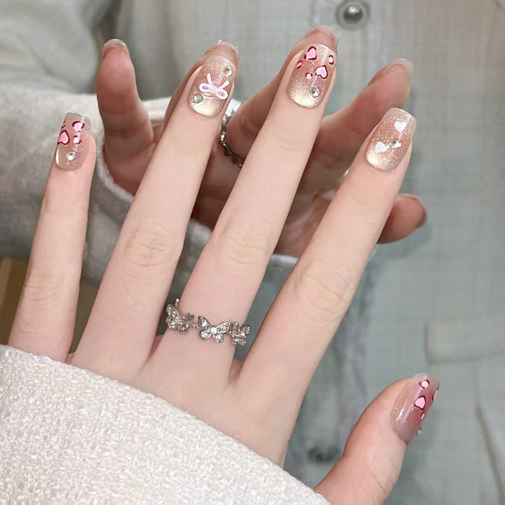 Artistic Press-On Nail Set with Heart and Bow Designs Bowlift
