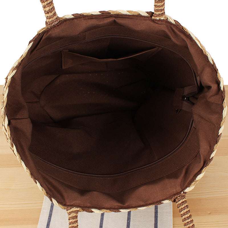 Summer wicker handbag with pom poms Bowlift