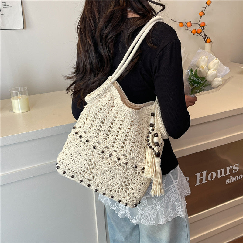 Hand-knotted shoulder bag with playful fringe design Bowlift