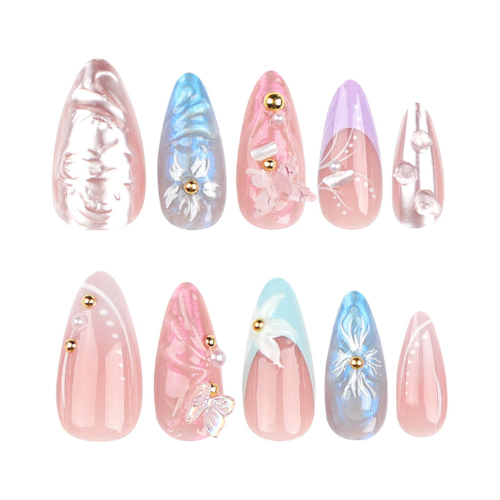 Artistic stiletto nails with delicate flower and glitter embellishments Bowlift
