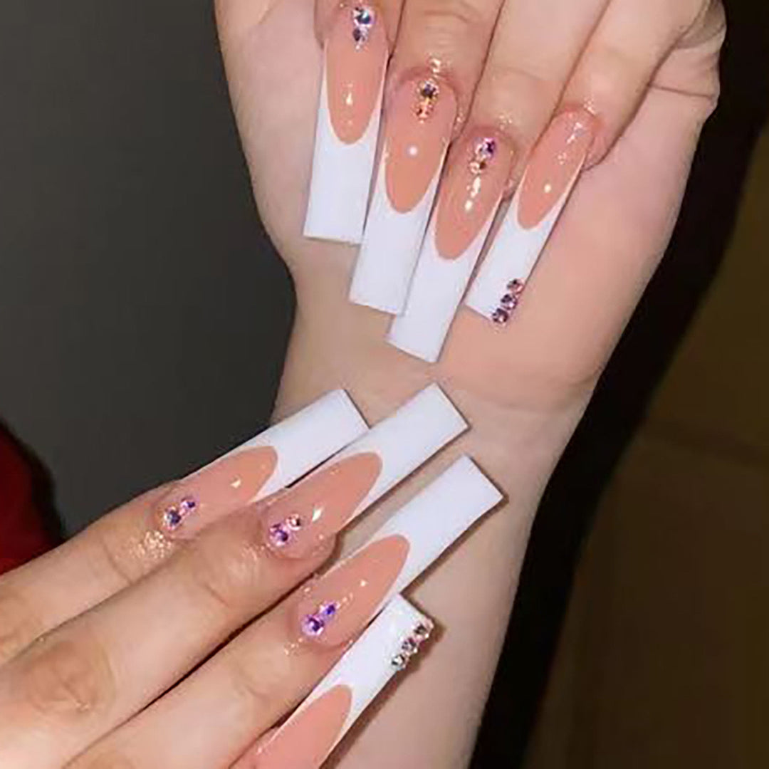 Nail set with elegant French tips and sparkling rhinestone embellishments Bowlift