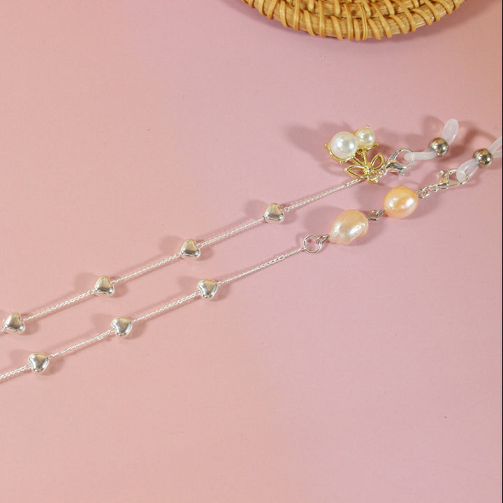 Elegant jewelry ribbon with pearls and silver accents Bowlift