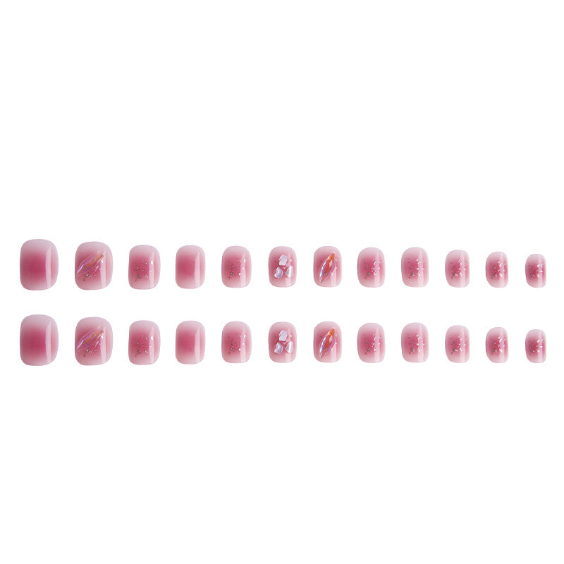 Artificial nails with delicate glitter design and floral accent Bowlift