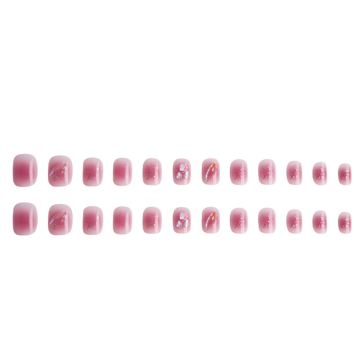Artificial nails with delicate glitter design and floral accent Bowlift