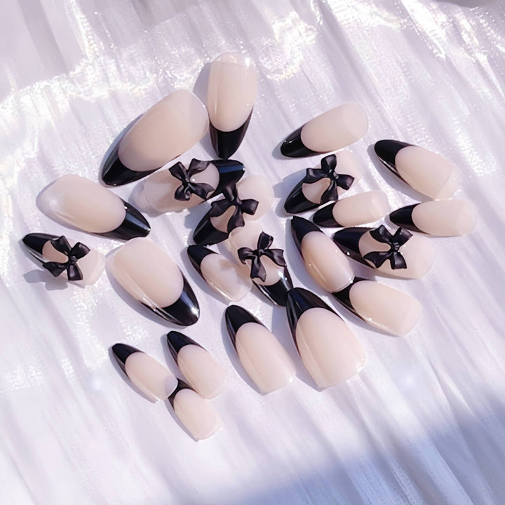 Artistic Stiletto Press-On Nail Design with Bow Accents Bowlift
