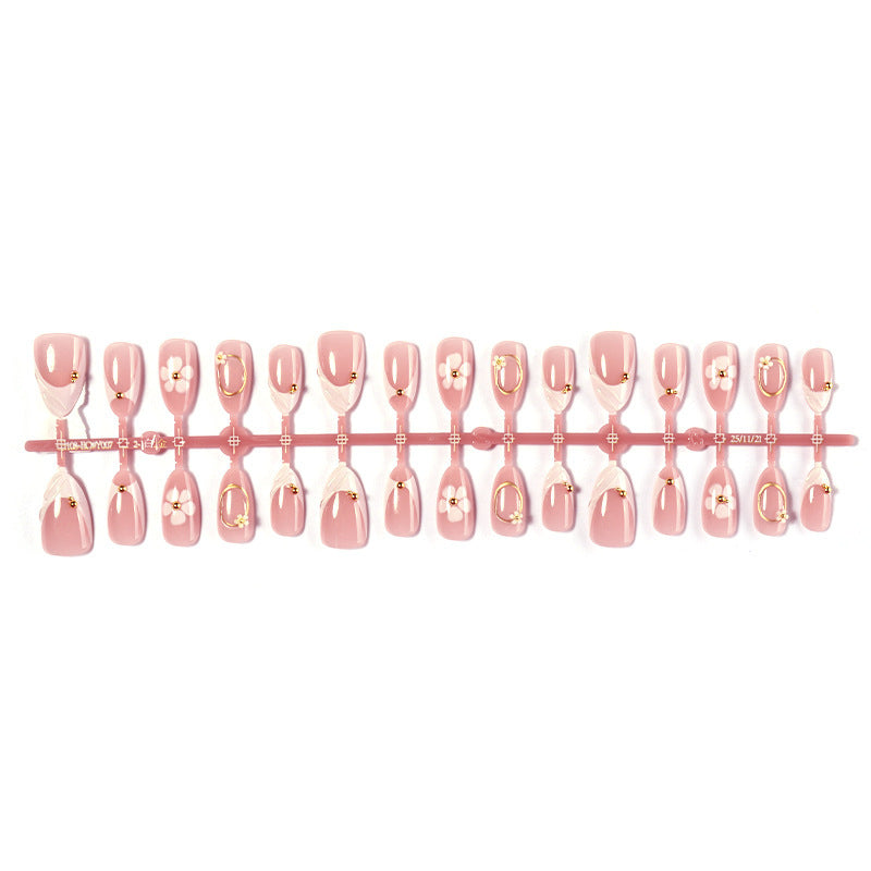 Artificial nail set with elegant flower and glitter accents Bowlift