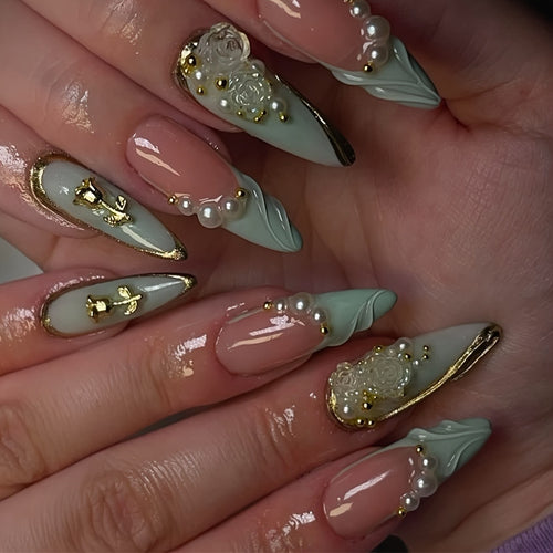 Luxurious Stiletto Nail Enhancements with Floral Accents Bowlift