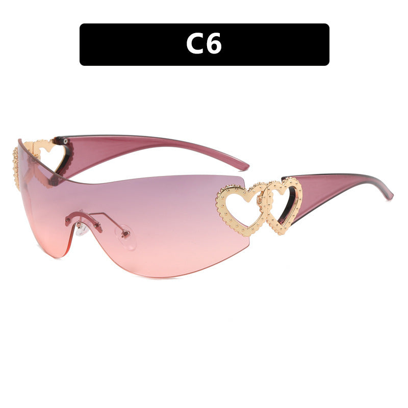 Ladies sporty sunglasses in trendy shield design with heart accents Bowlift