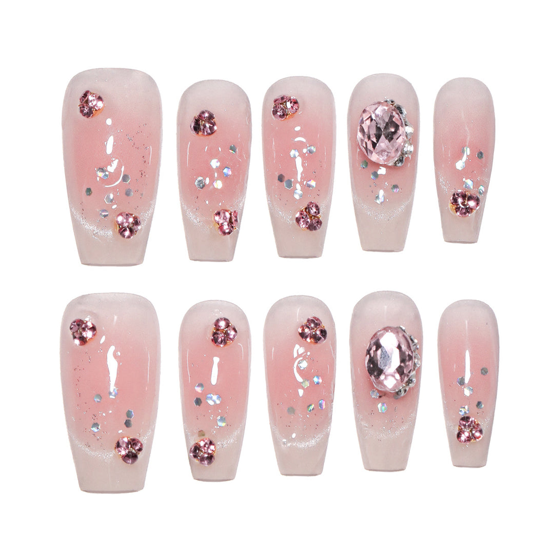 Artificial nail extensions with artistic glitter accents Bowlift