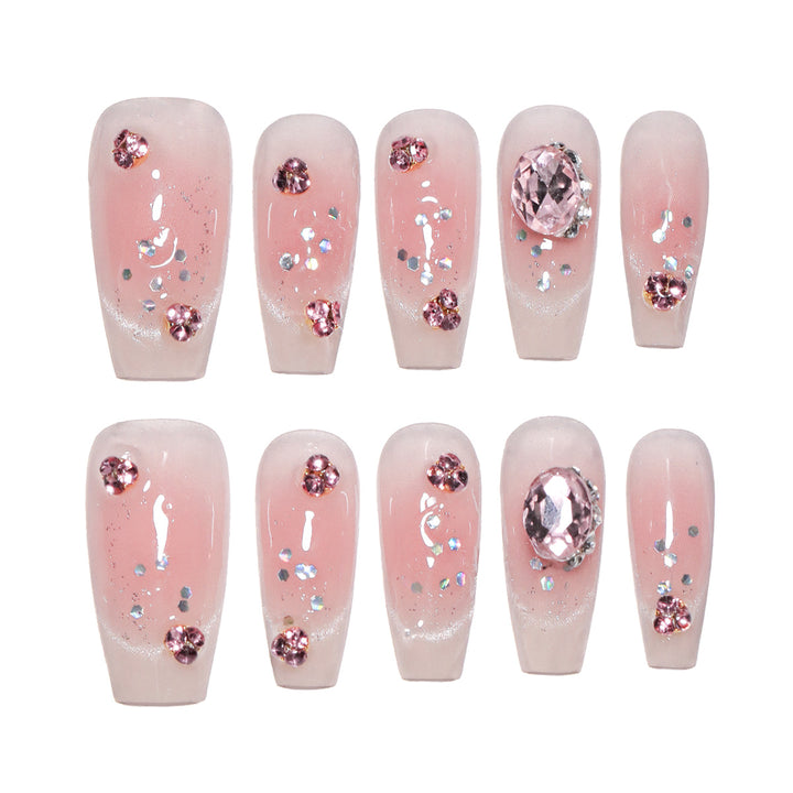 Artificial nail extensions with artistic glitter accents Bowlift