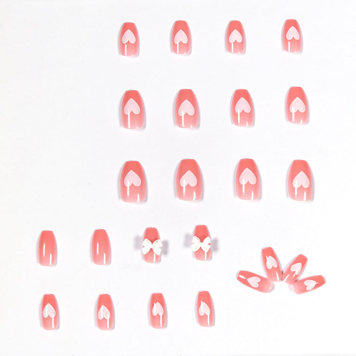 Artistic acrylic nails with heart and bow motifs Bowlift