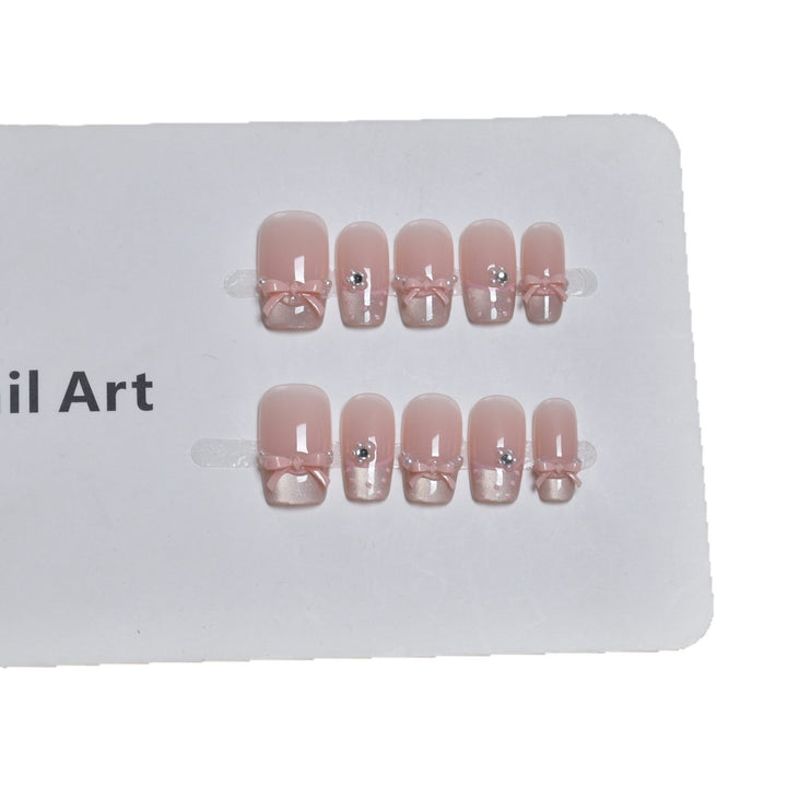 Elegant French Tip Press-On Nail Art with Bow Accents Bowlift
