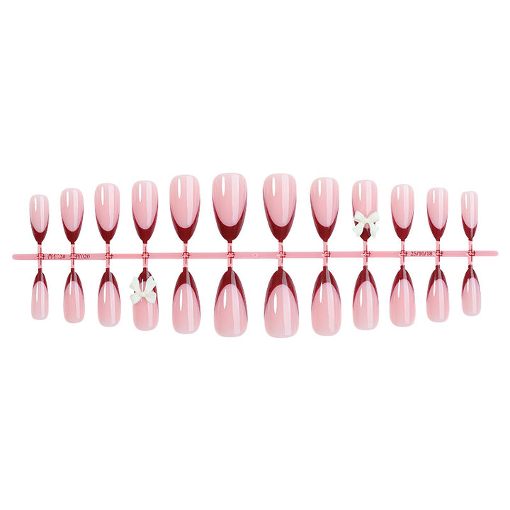 Acrylic nail set with creative French tip design and cute bows Bowlift