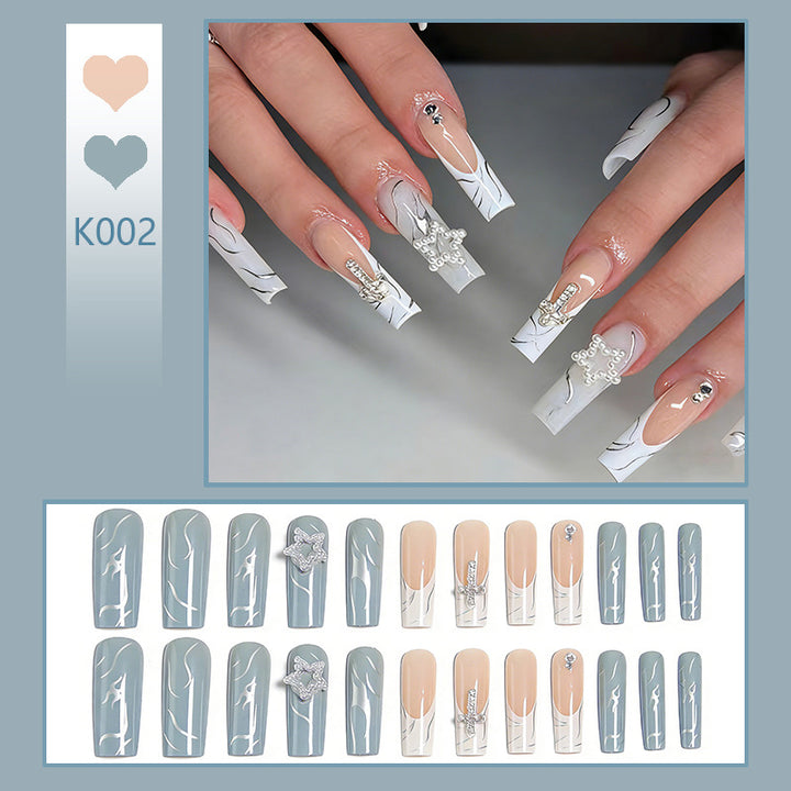 Artificial nails with luxurious marble design and radiant embellishments Bowlift