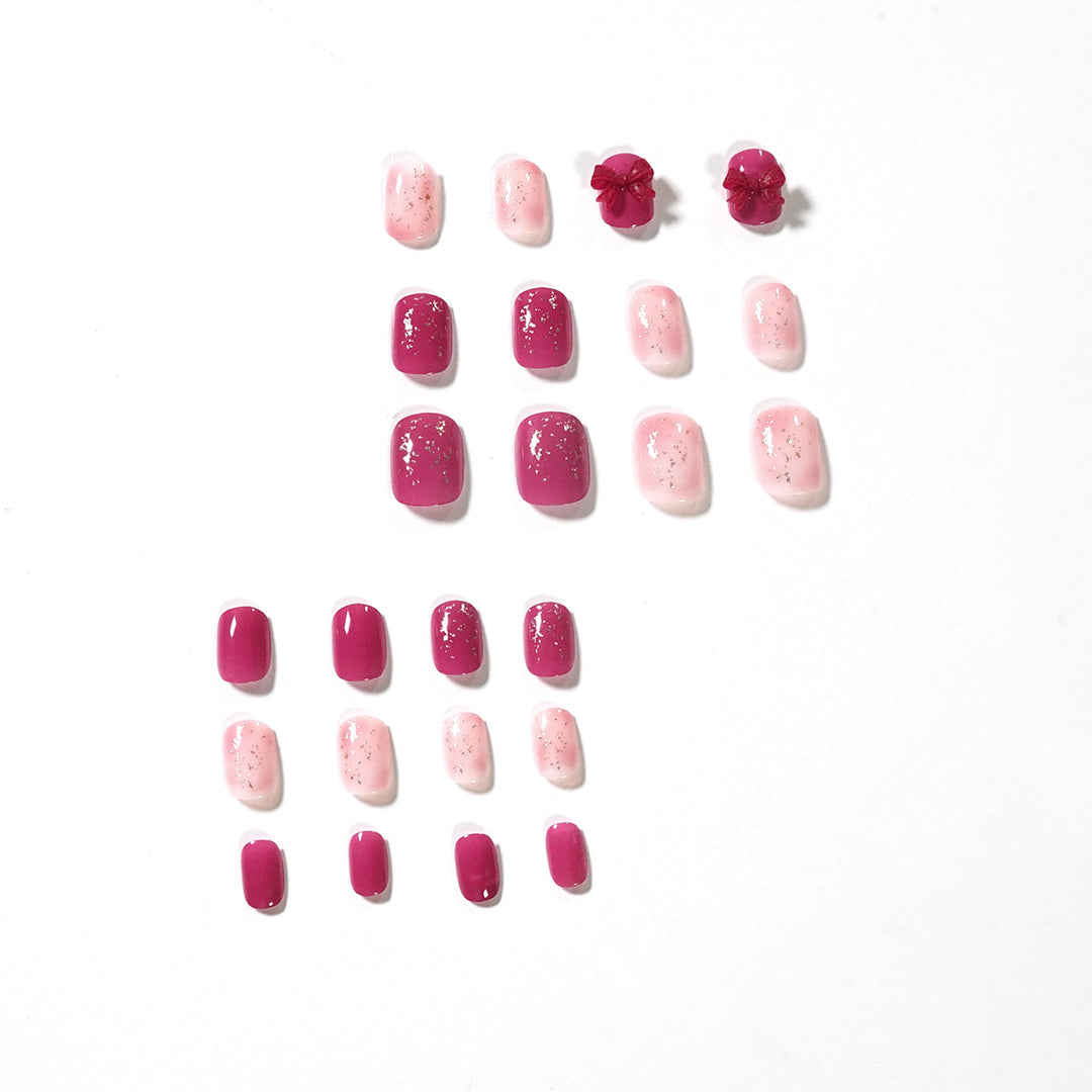 Artificial nail art with glitter embellishments and cute bow motif Bowlift