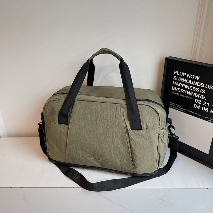 Sporty travel bag with practical outer pockets Bowlift