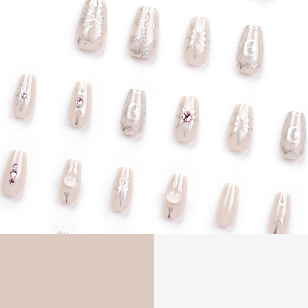 Artificial nail art with elegant rhinestone and glitter effects Bowlift