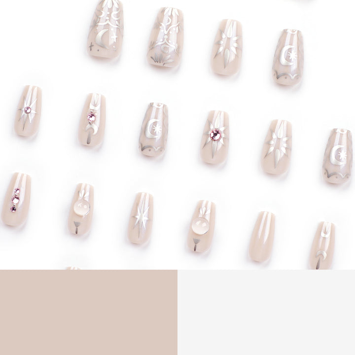 Artificial nail art with elegant rhinestone and glitter effects Bowlift