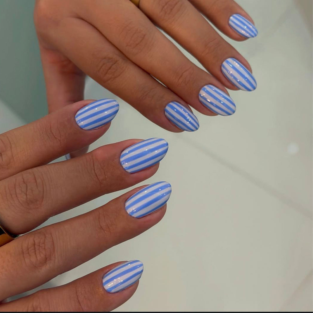 Artful nail art with maritime striped pattern Bowlift
