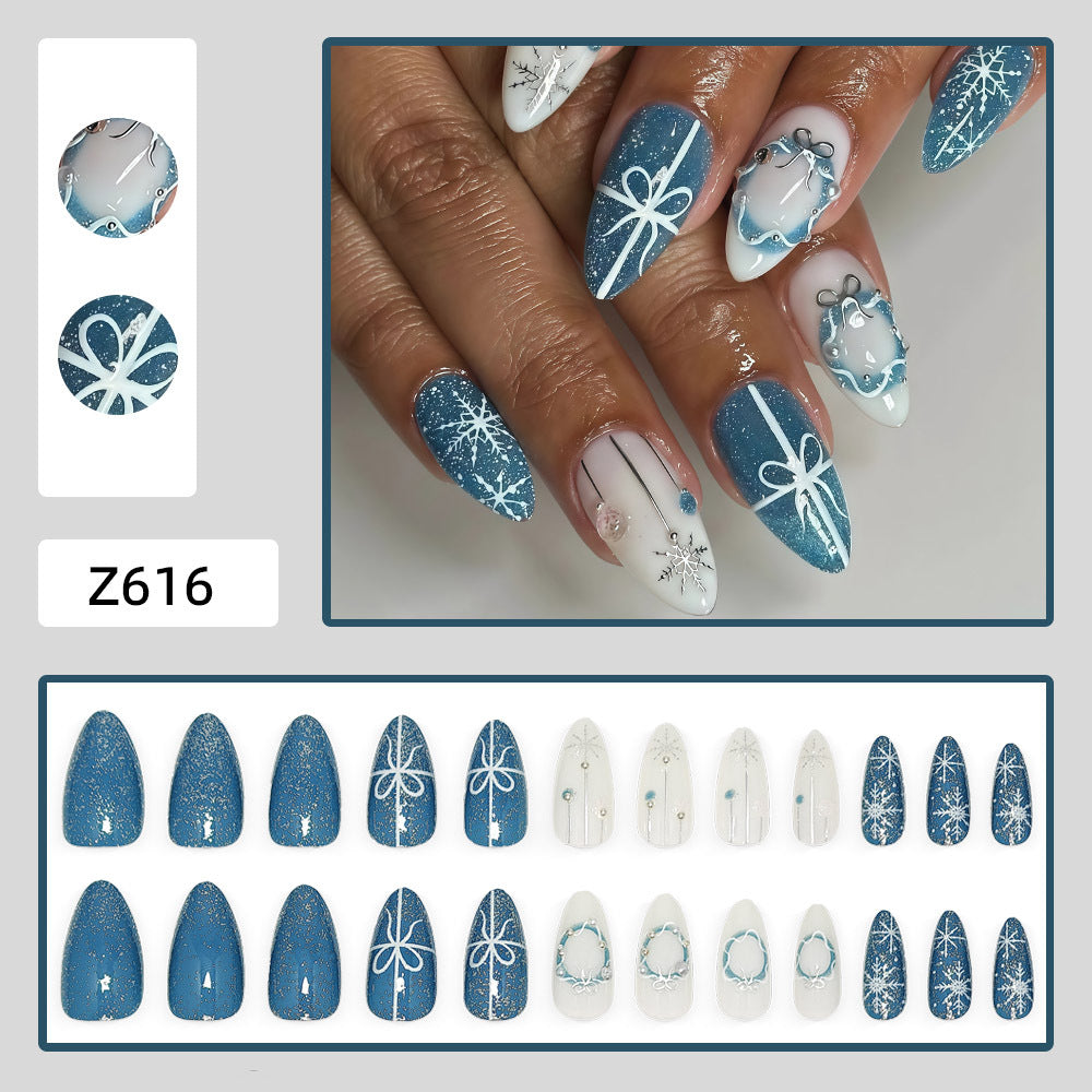 Artificial nails in elegant winter design with glitter accents Bowlift