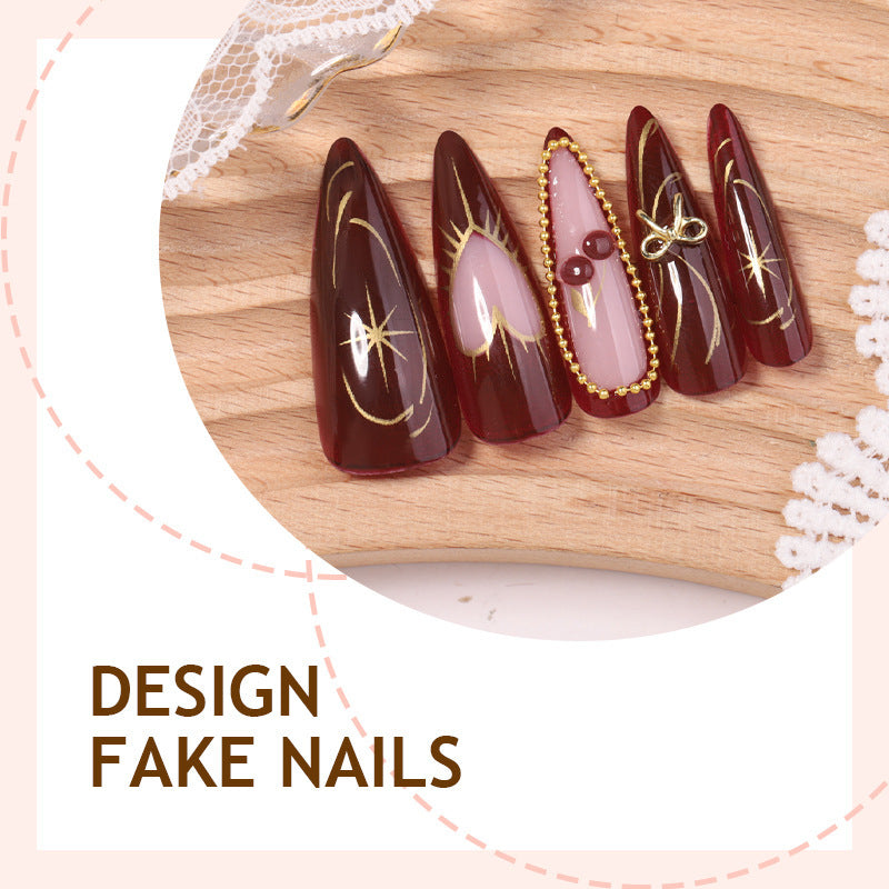 Artificial nail set with luxurious golden accents and glamorous design Bowlift