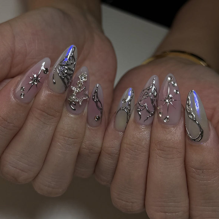 Artistic nail art with unique 3D decorations and glitter accents Bowlift