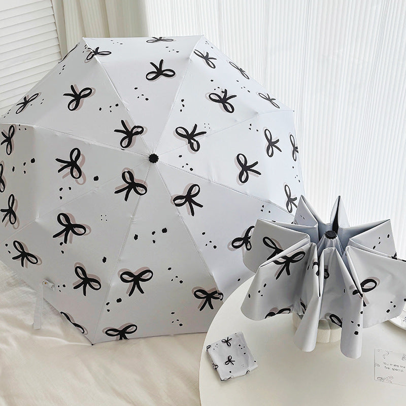 Women’s Folding Umbrella with Playful Bow Pattern Bowlift