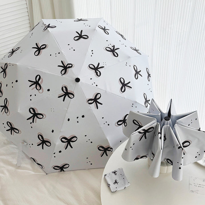 Women’s Folding Umbrella with Playful Bow Pattern Bowlift