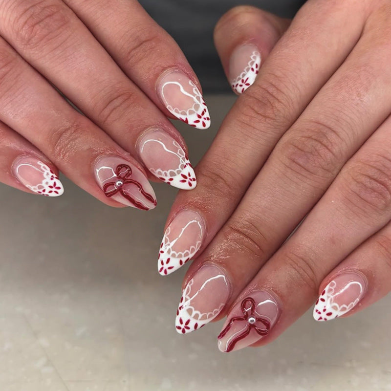 Artful acrylic nails with elegant floral accents Bowlift