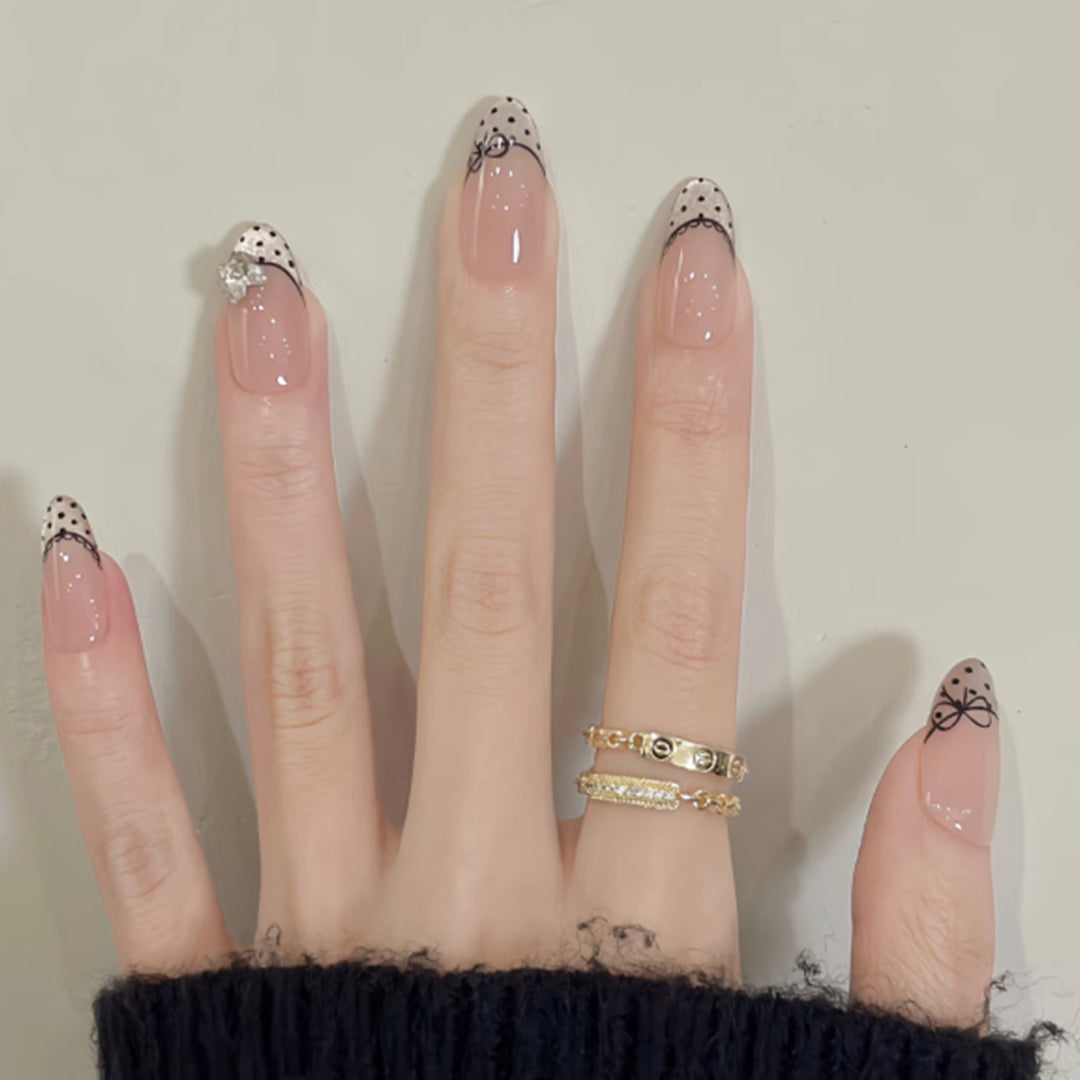 Elegant artificial nails with glitter and French design Bowlift