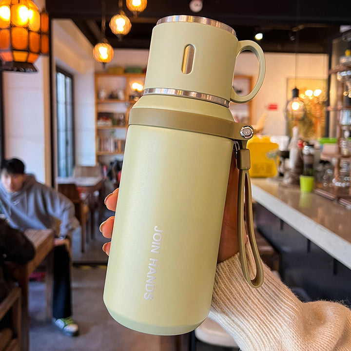 Women's insulated stainless steel drinking bottle with foldable cup Bowlift