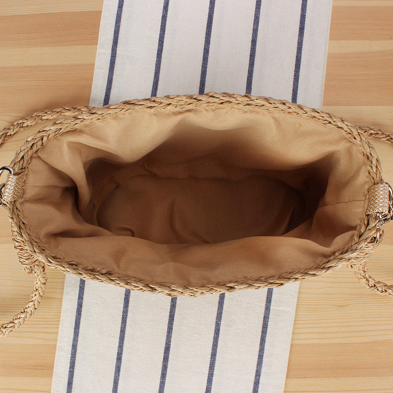 Handbag made of hand-woven natural material with pearl decoration Bowlift