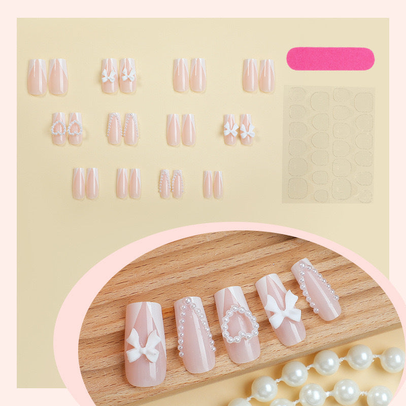 Artificial nail set with filigree hearts and bow decorations Bowlift
