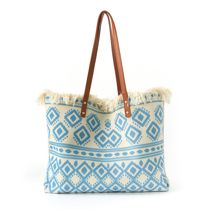 Beach bag with floral pattern and fringes Bowlift